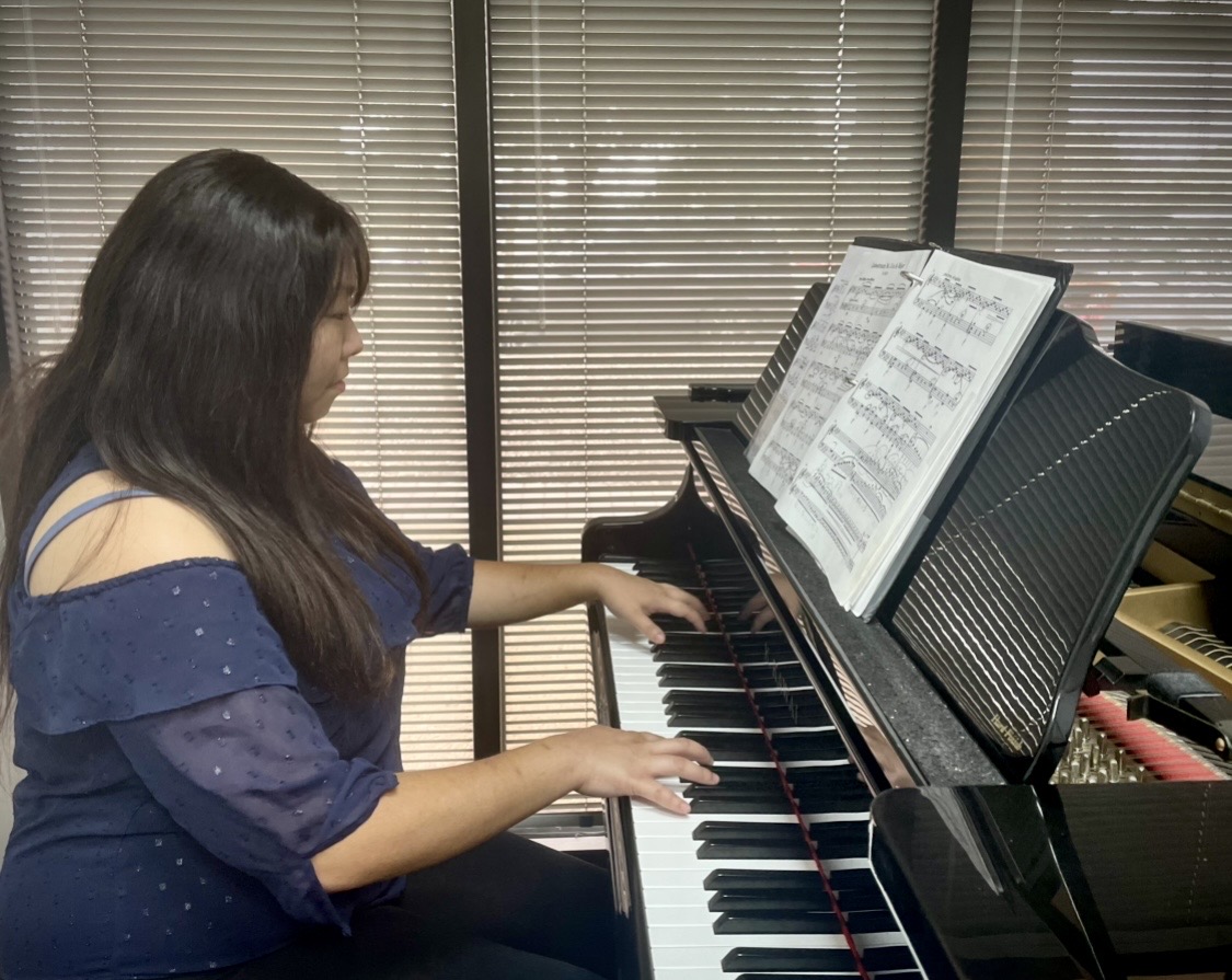 Bright Keys Piano Studio adult student playing piano during lesson